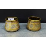 A pair of brass and mixed metal Cairo ware type bowls, 7cm tall, (2)