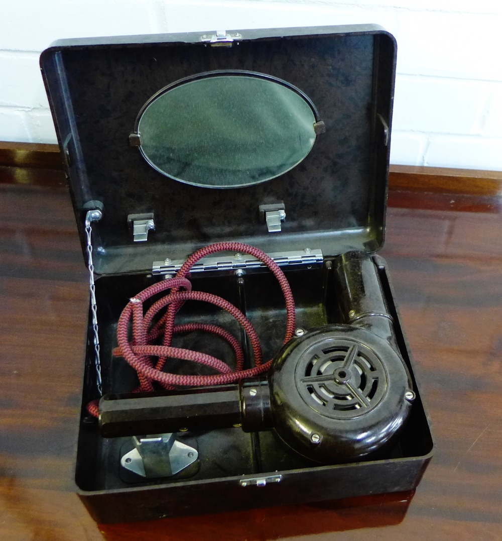A vintage Bakelite hairdryer in fitted box