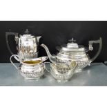 A three piece Epns half gadrooned tea and coffee set comprising, teapot, coffee jug and cream jug,