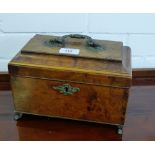 A 19th century burr wood tea caddy the sarcophagus lid with brass handle escutcheon and four paw