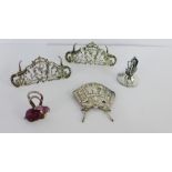 A collection of menu card holders to include a pair of Birmingham silver, one Chester silver and