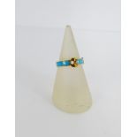 18 carat gold and turquoise enamel and pearl set buckle ring, UK ring size L