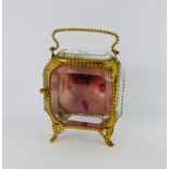 A late 19th / early 20th century gilt metal and glass panelled watch / trinket case, with swing