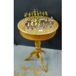 A contemporary chess set with brass chess pieces together with a chess board table (a lot)