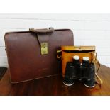 Vintage brown leather briefcase together with a pair of binoculars in a tan leather case, (2)