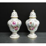 Pair of continental porcelain pierced jar and cover vases, the lids with gilt acorn finials and with