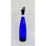 Bristol blue glass bottle with white metal and cork fruit and vine stopper, 35cm high