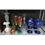 A collection of coloured glass wares to include a decanter, vase, scent bottle, drinking glasses