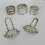 Victorian silver napkin ring and two Epns napkin rings together with a pair of Epns decanter