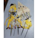 Collection of antique painted card puppets on horn handles to include four male figures and another,