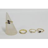 Three 9 carat gold diamond and gemset dress rings together with a yellow metal and paste set ring (
