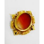 Victorian mourning brooch with revolving central panel with an oval agate and braided hair panel,