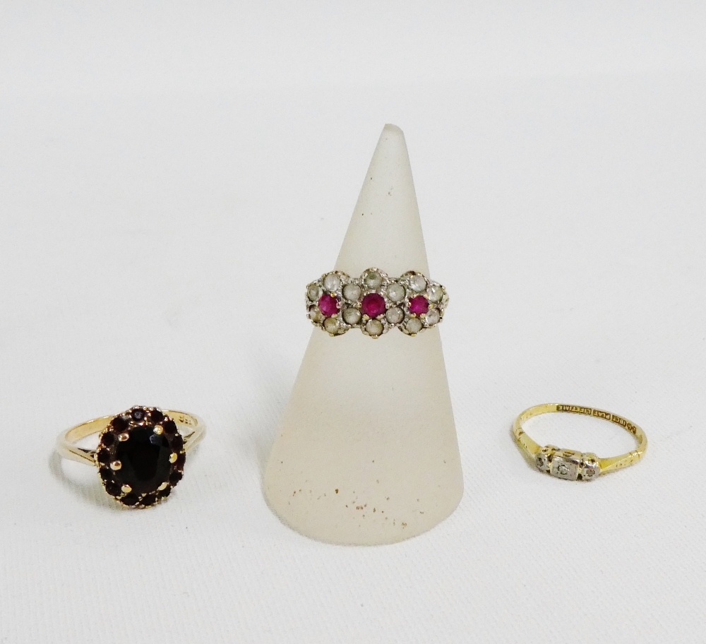 18 carat gold and three stone diamond ring together with two 9 carat gold gemset dress rings (3)