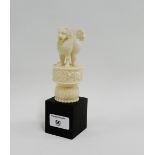 Early 20th century carved ivory figure group of three lions on a lotus base and ebonised rectangular