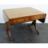 19th century rosewood sofa table of typical form with drop leaves, two long drawers and reeded