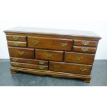 Contemporary American cherrywood chest, the long rectangular top above a consignment of drawers on