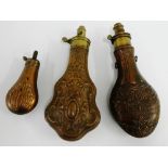 Three powder flasks to include Sykes Patent and Hawksley Sheffield and another smaller, largest 21cm