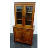 19th century mahogany bookcase cabinet with a pair of glazed doors above two short drawers and two