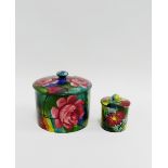 Two Wemyss pots and covers in 'Jazzy' pattern with printed backstamps, largest 13cm wide, (2)