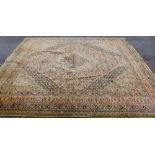 A large Keshan style carpet with foliate ground and multiple flowerhead borders, 405 x 355cm