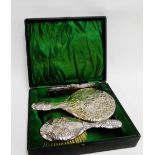 George V silver backed dressing table brush set with Reynold's cherub pattern comprising mirror,