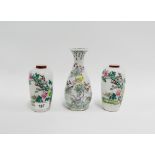 Pair of Japanese porcelain high shouldered floral patterned baluster vases together with another