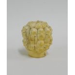 An early 20th century Japanese 'many heads' carved ivory finial, signed, 4cm