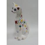 C.H. Brannam Ltd of Barnstable, white glazed Galle style cat painted with red, yellow and green