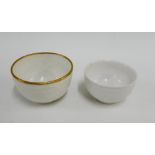 Early Derby swag moulded teabowl, circa. 1775, left in the white, together with a later puce