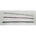 Three silver and gemset set tennis style bracelets to include black diamonds, topaz and garnets (3)