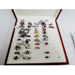 A quantity of garnet, ruby and coloured gemset silver jewellery to include dress rings, earrings and