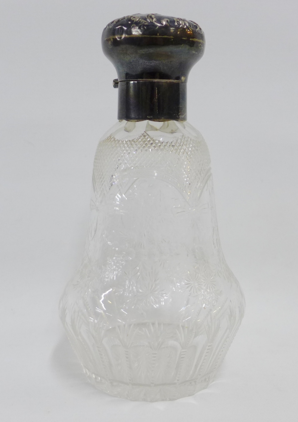 Edwardian silver mounted and glass scent bottle by William Comyns, with hobnail and floral garland