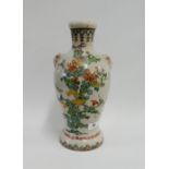 Japanese earthenware vase with mask head lugs and painted with stylised flowers and foliage, 31cm