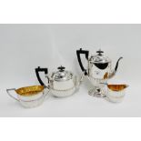 Edwardian silver four piece tea and coffee set with half fluted decoration, comprising teapot,
