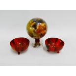 Three pieces of early 20th century painted art glass to include two bowls on three out swept feet