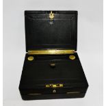 Black leather covered writing box, the hinged lid opening to reveal a pull out slide and fitted