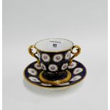 English porcelain two handled cup and Trembleuse stand with cracked iced gliding over a blue ground,