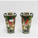 Pair of Aux Kutani vases with twin handled lugs and finely painted with wisteria, birds and foliage,