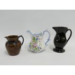 A group of three 18th and 19th century earthenware jugs, tallest 17cm, (3)