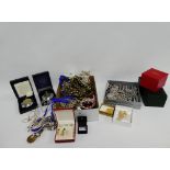 Carton containing a collection of costume jewellery to include beads, bangles, necklaces, etc., (a