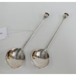 Graham Leishman Stewart silver spoons with rat tail hammered bowls and poppy head seal terminals,