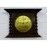 Oak wall barometer, the brass dial flanked by spiral pilasters, 34 x 46cm