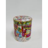 Chinese canton enamel Famille Rose cylindrical jar and cover painted with figures in a courtyard and