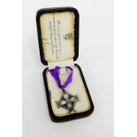 WWI George V Memorial Cross - The Gift of Canada, the silver cross suspended on a purple silk ribbon