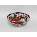 Chinese Imari patterned bowl painted with prunus and scrolls on plain circular footrim, 19cm