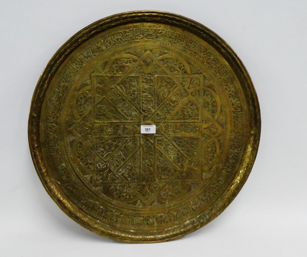 Eastern brass circular tray with calligraphy and stylised flowers, 60cm diameter