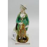 Staffordshire porcelain figure of a Lady Archer on a square lined base with a "Sothebys Iris Fox"