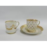 Caughley porcelain cup and saucer with gilt foliage and dot pattern, together with a similar small