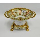 Noritake twin handled bowl with gilt handles and borders and painted floral panels, complete with