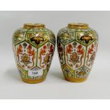 Pair of Noritake high shouldered baluster vases with dragon pattern panels and gilt edged rims,